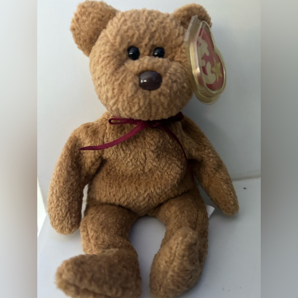 Rare Beanie Babie Curly. Brown nose,date errors,tag errors and stamped tush tag!